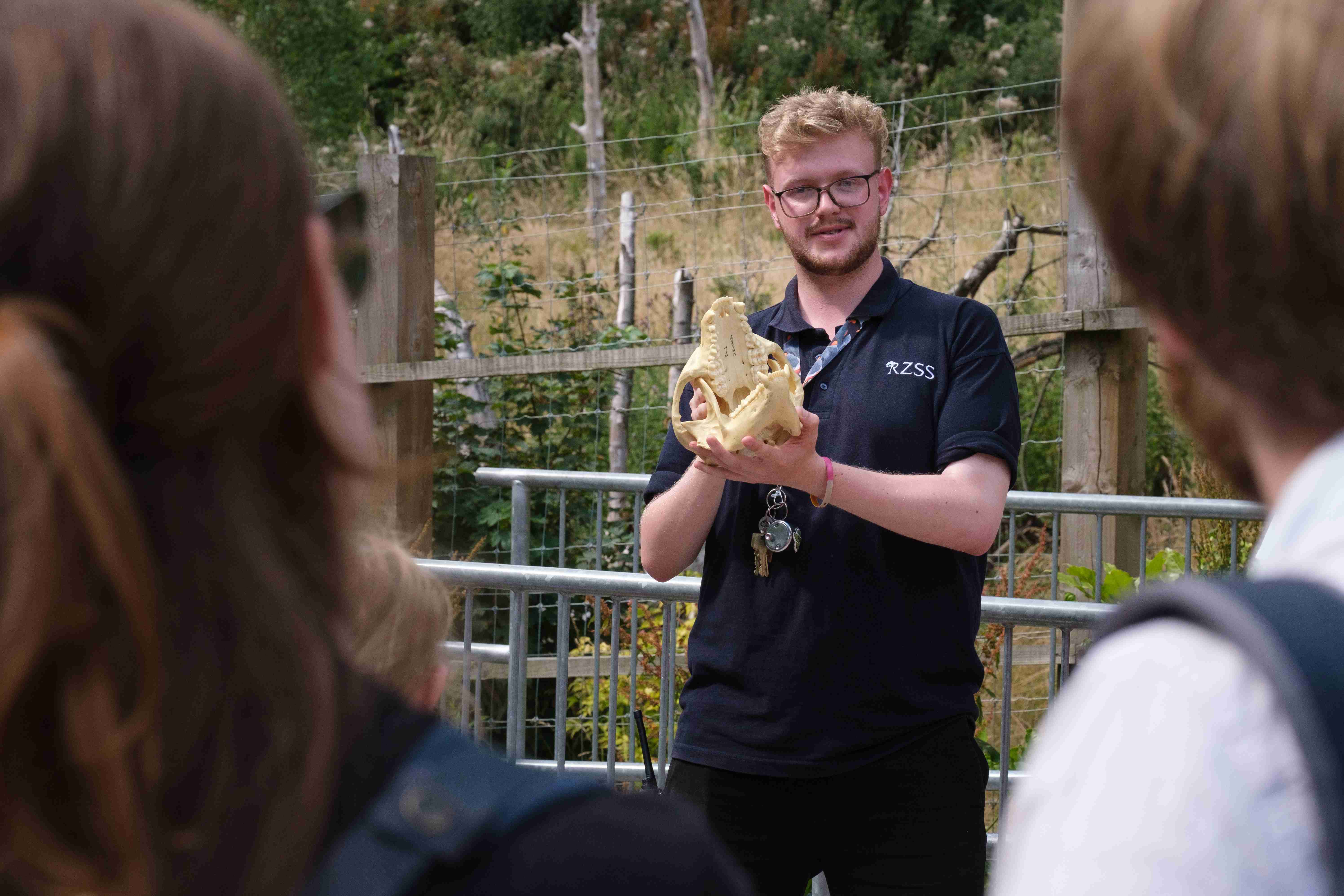 Discovery ranger Maurice Hickman giving talk holding animal skull

IMAGE: Robin Mair